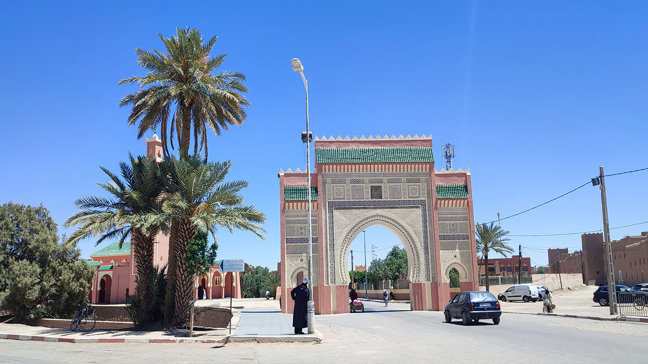 Ornate gate in Rissani, Morocco under blue sky