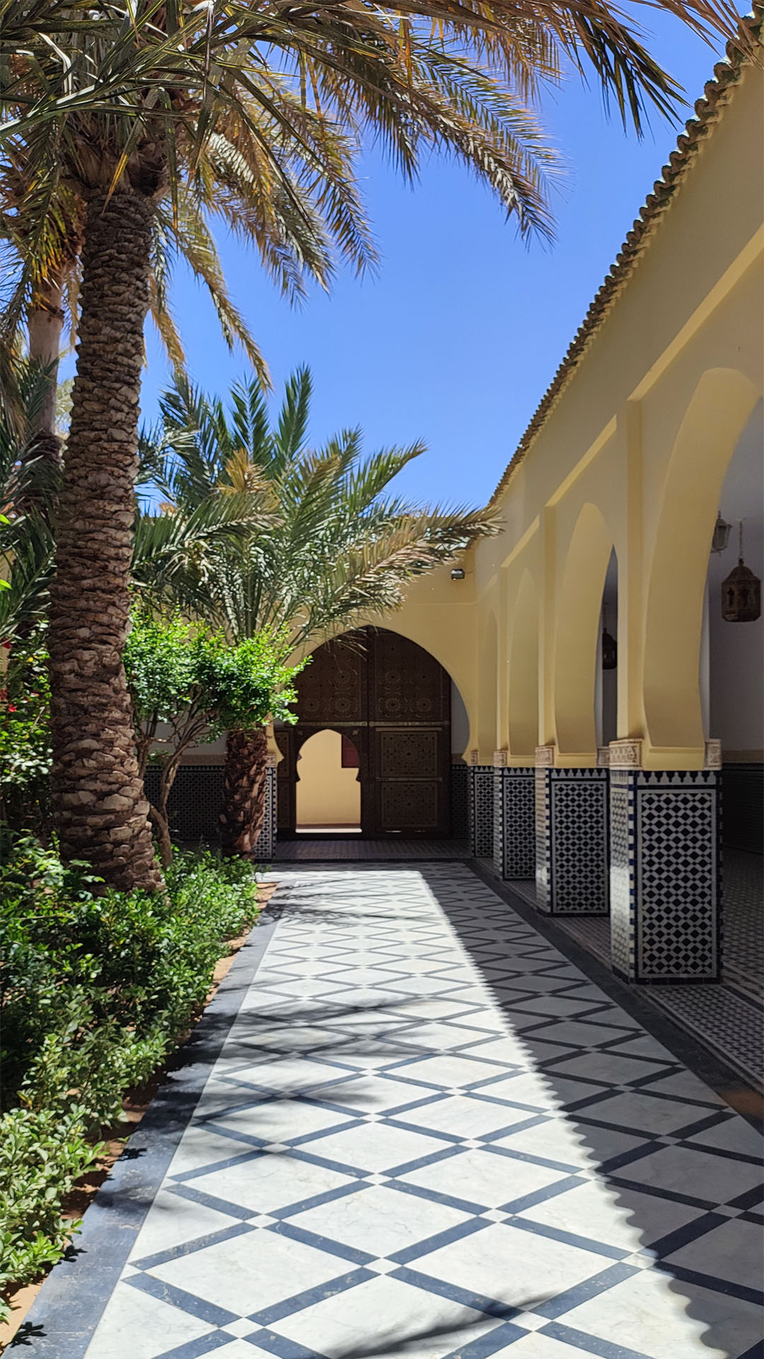 Sunlit Moroccan courtyard at Mausoleum of Moulay Ali Cherif.